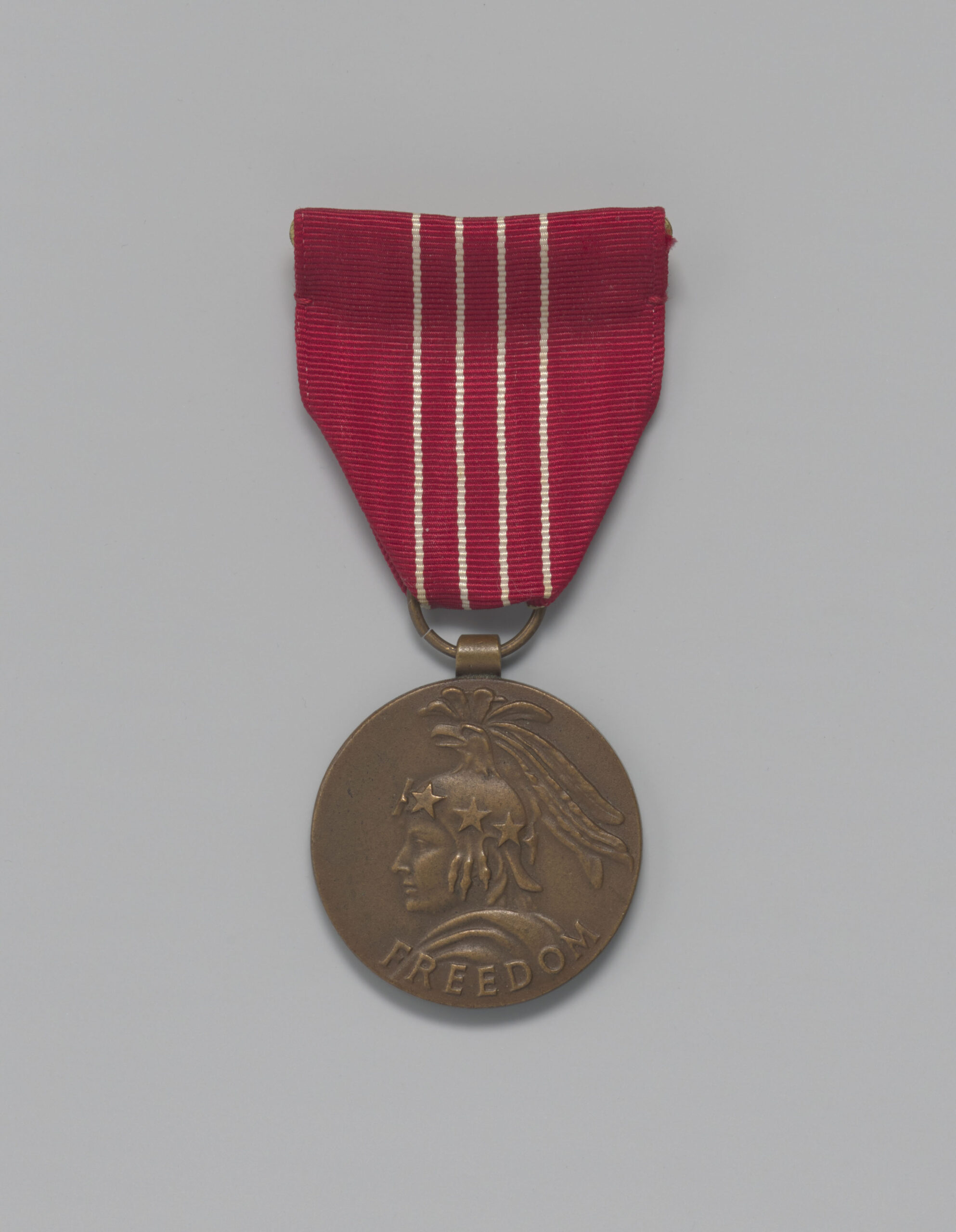 a bronze medal on a gray background