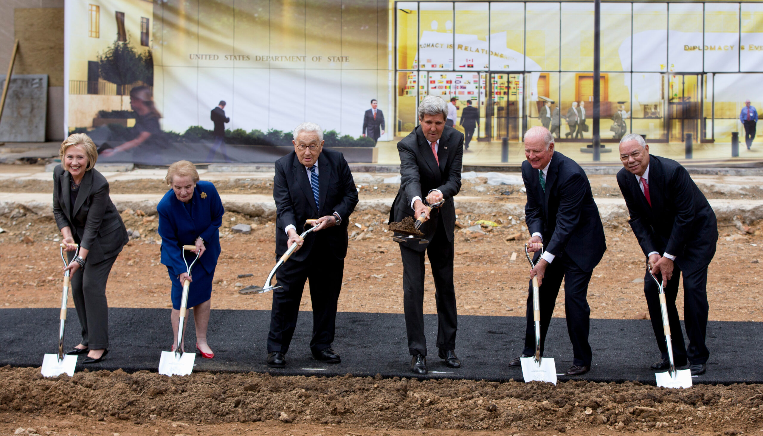 Secretaries of State Hillary Rodham Clinton, Madeleine Albright, Henry Kissinger, John Kerry, James A. Baker III, and Colin Powell participate in the groundbreaking ceremony
