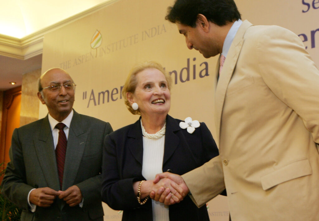 Former U.S. Secretary of State Madeleine Albright, center, is greeted by Vice President of The Aspen Institute India Gautam Thapar.