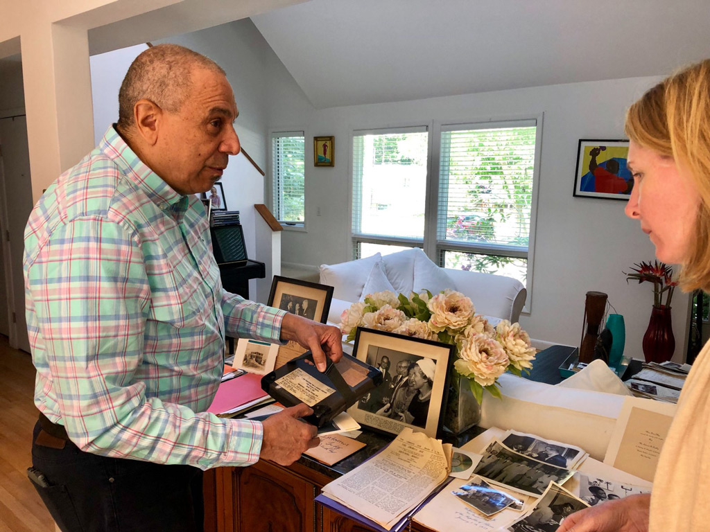 Edward Dudley Jr. shows items in his home to curator Katie Speckart