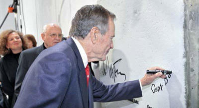 George H.W. Bush signing the wall