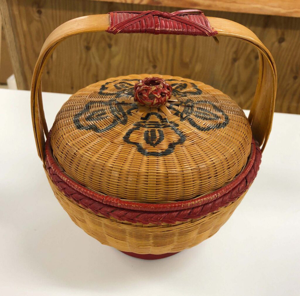 A woven basket with a handle
