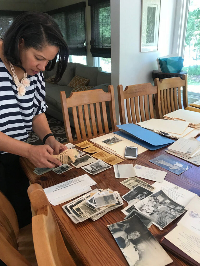 Jane Carpenter-Rock looks at photos on a table