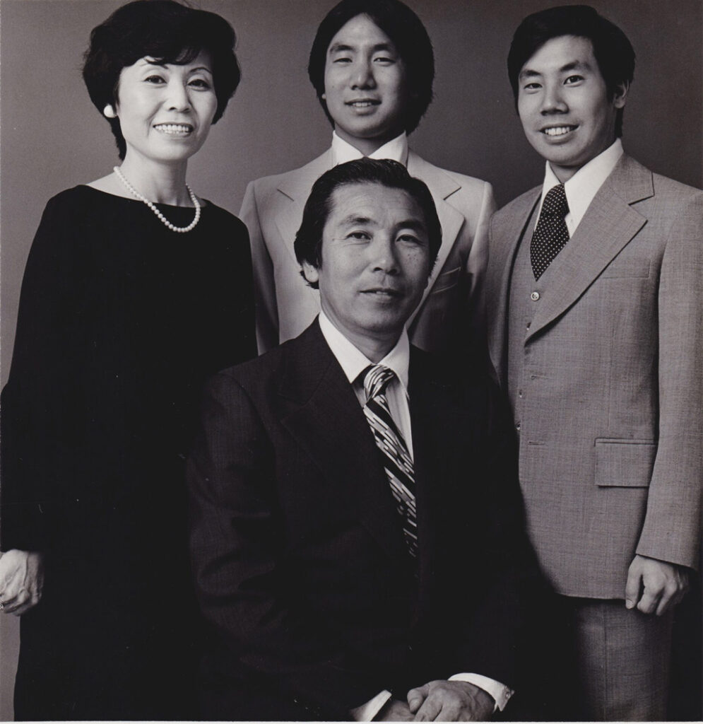 Donald Yamamoto (right) with his brother (back center), his mother (left), and his father (front center).