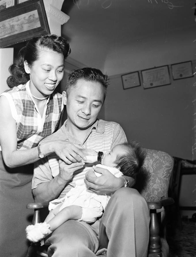 Sammy Lee with his wife and child