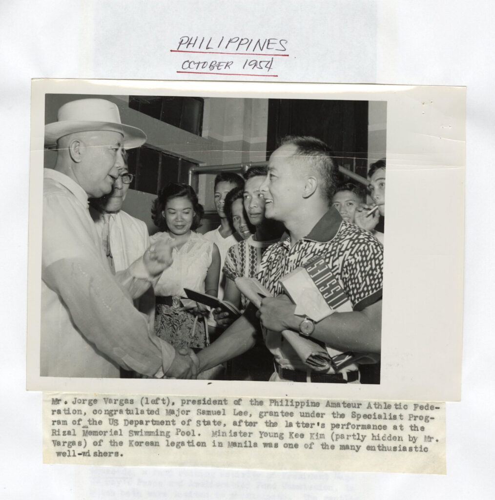 Philippines Amateur Athletic Club President, Dr. Jorge Vargas, shakes hands with Sammy after his diving performance