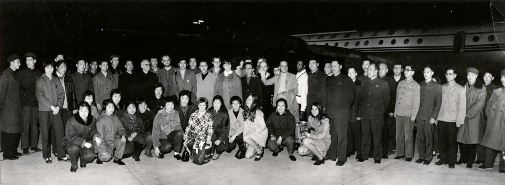 The U.S. Table Tennis team poses in front of an airplane with Chineses officials