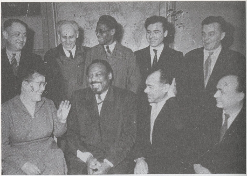 Robinson with a group of people including Paul Robeson