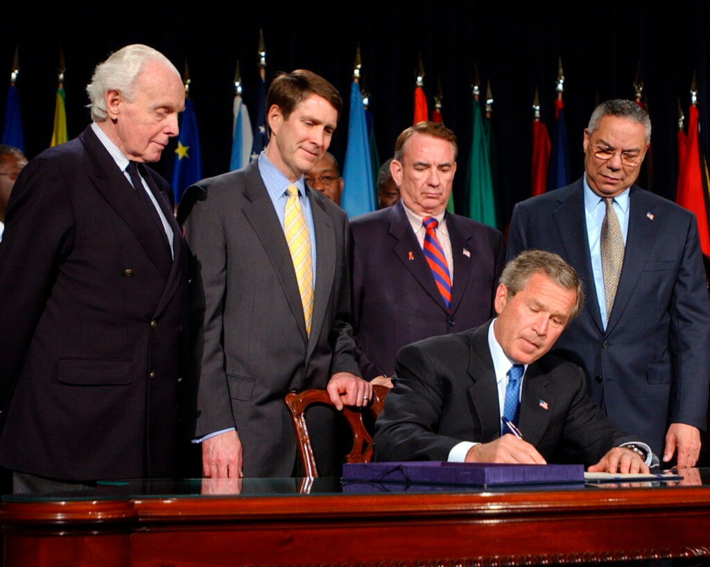 President George W. Bush signing PEPFAR into law