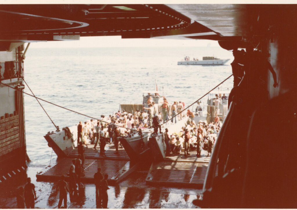 evacuees boarding a merchant ship