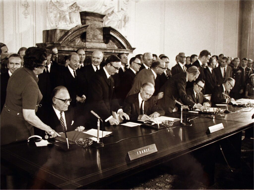 From left, French Foreign Minister Maurice Schumann, British Foreign Minister Alexander Douglas-Home, Russian Foreign Minister Andrei Gromyko and U.S. Secretary of State William Rogers sign the final protocol of the four power Berlin agreement in West Berlin. June 3, 1972.
National Archives and Records Administration.