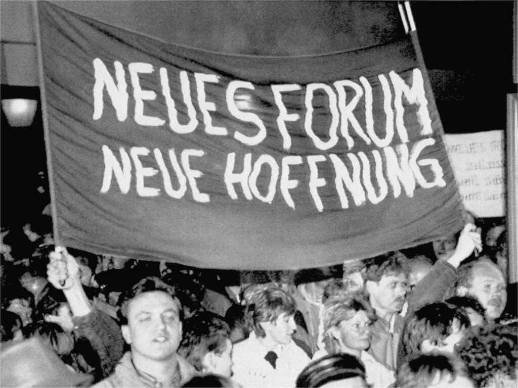 East German demonstrators carrying a banner which reads “NEW FORUM, NEW HOPE” during a peaceful protest march in downtown Leipzig October 30, 1989. By the end of October, the Monday demonstrations had grown from 20,000 attendees to more than 300,000. AP photo
