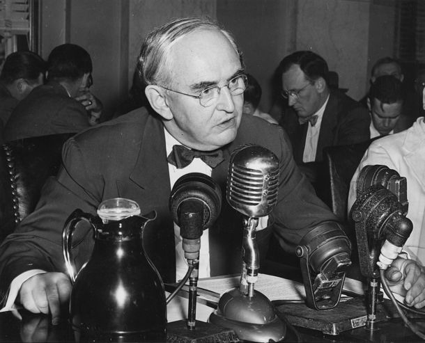 Senator Vandenberg speaks at a desk in front of a microphone