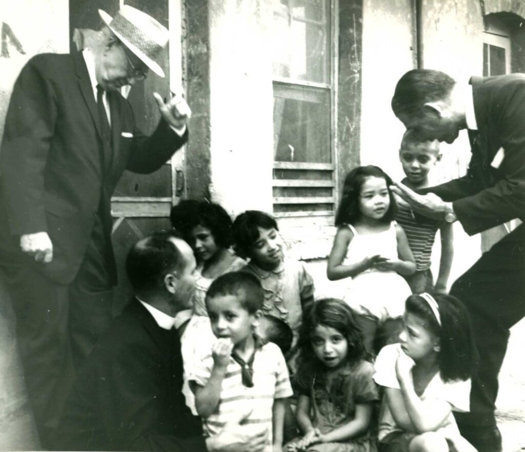 telles with a group of children in el paso