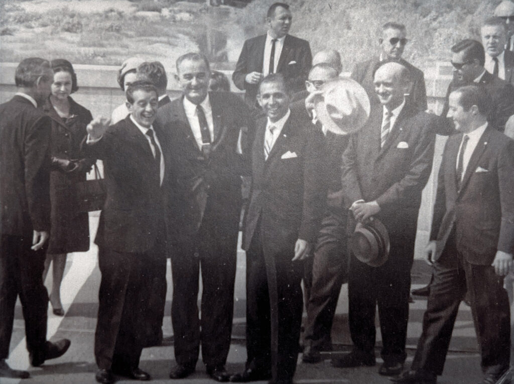 group of men in suits at the mexico border