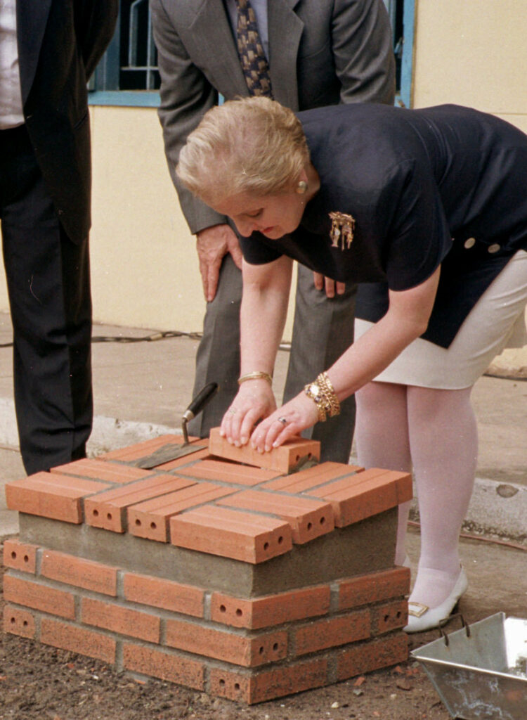 Albright laying a brick