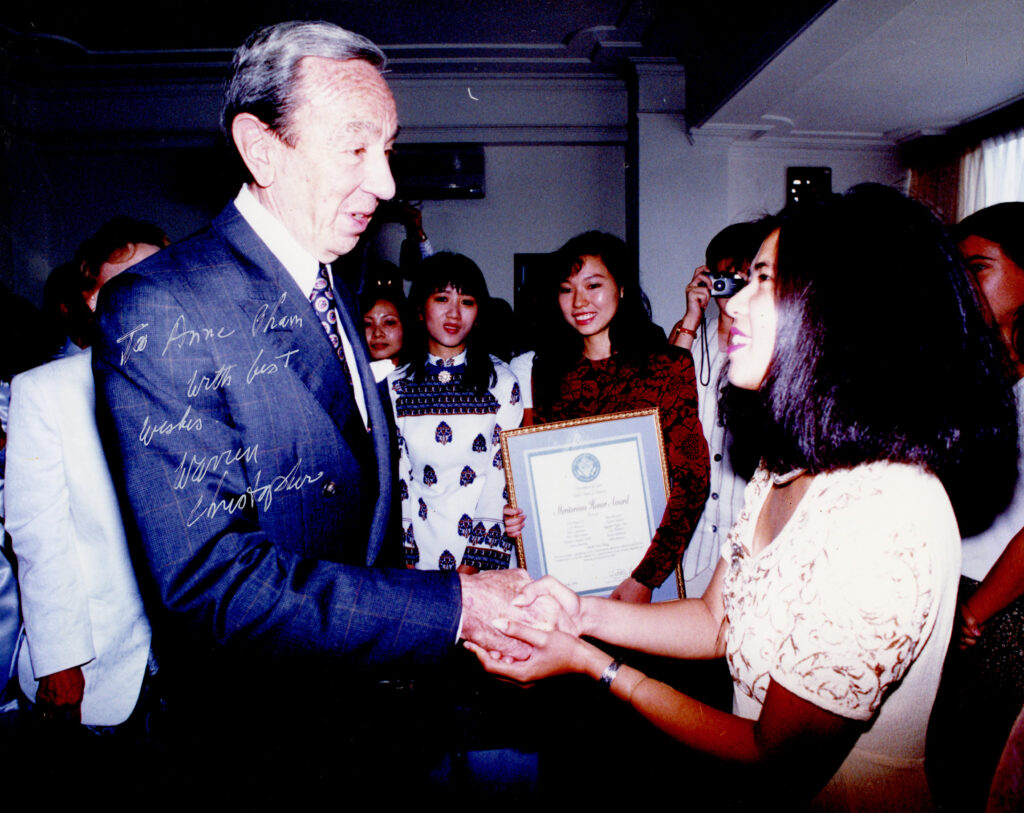 warren christopher shaking hands with anne pham
