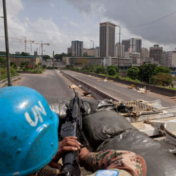 UN peacekeeper on a tank with a blue helmet