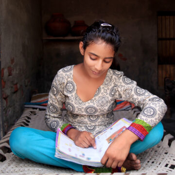 Girl reading a textbook