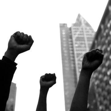 Silhouette of closed fists in black and white