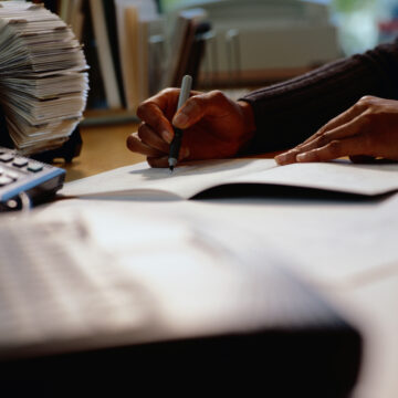 Person writing in a notebook