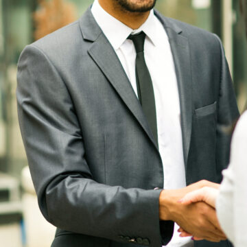 Man in a suit shacking hands