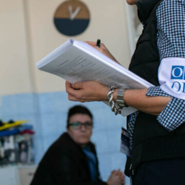 Election observer holding a clipboard