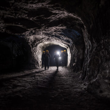 A group of men with hardhats in a mine