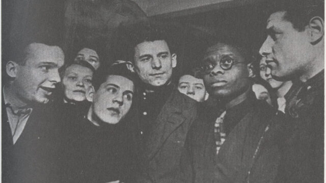 Robinson surrounded by his shop colleagues in Moscow