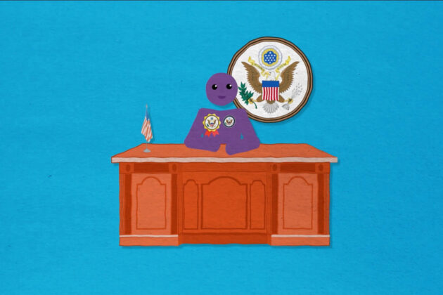 A figure sitting at the Secretary of State's desk