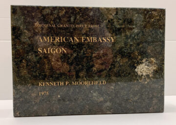 a square piece of granite that says Original Granite Piece from American Embassy Saigon, Kenneth P. Moorefield, 1975