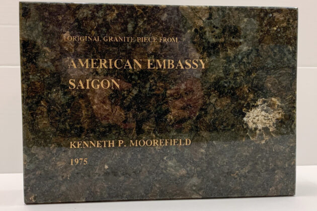 a square piece of granite that says Original Granite Piece from American Embassy Saigon, Kenneth P. Moorefield, 1975