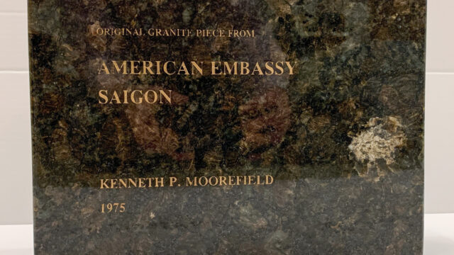 a square piece of granite that says Original Granite Piece from American Embassy Saigon, Kenneth P. Moorefield, 1975