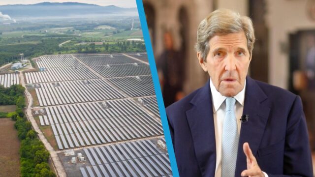 Secretary John Kerry next to an image of solar panels