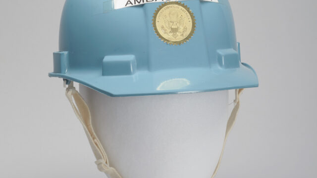 Blue hard hat on a mannequin head with the word AMBASSADOR taped to the front.