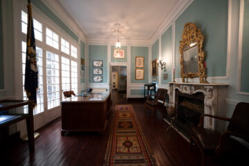 A historic living area with blue walls.
