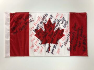 small Canadian flag with writing