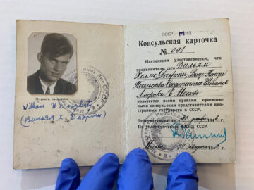 A bifold ID card with a photo, written in Russian.