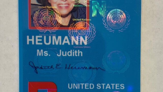 A rectangular blue ID card from the United Nations.