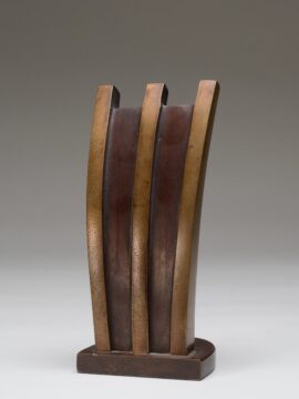 a bronze sculpture with three lines