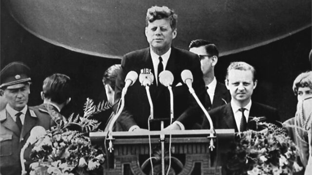 U.S. President John F. Kennedy delivers his famous “I am a Berliner” (“Ich bin ein Berliner”) speech in front of the city hall in West Berlin. On the far right of the image is West Berlin Mayor Willy Brandt.