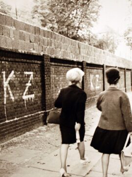 On the western side of the Berlin Wall, the graffiti letters “KZ” stand for “Konzentrationslager” or “Concentration Camp,” indicating the graffiti artist's disdain for the Wall.