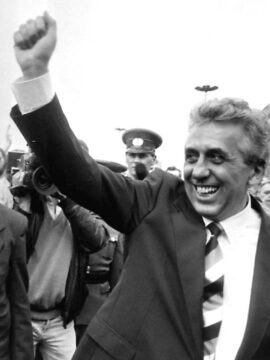 Egon Krenz raises his fist to the public in East Berlin six days after replacing Erich Honecker as East German leader and head of Communist Socialist Unity Party.