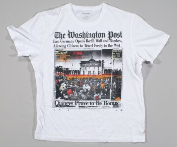 T-shirt with a screened image of an artistic rendering of the front page of the Washington Post’s November 10, 1989 edition.