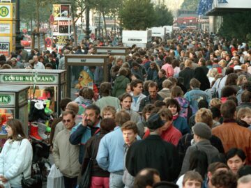 On November 18, 1989, the Kurfuerstendamm Boulevard, the main shopping thoroughfare in West Berlin, was crowded with people as hundreds of thousands came over from East Germany for shopping and sightseeing.