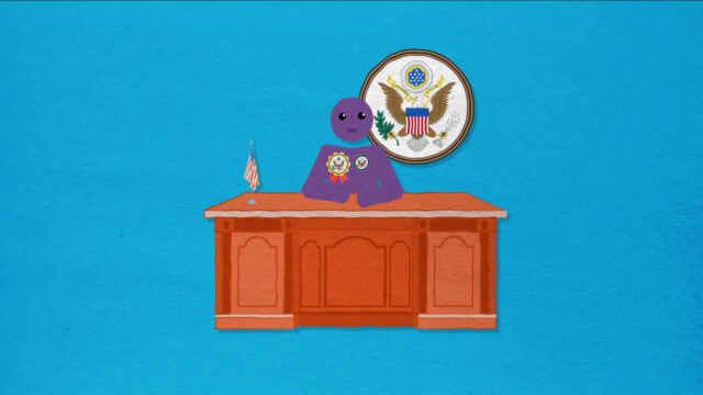 Una figura sentada en el escritorio del Secretario de Estado