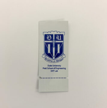 A small foil packet that features the seal of Duke University.