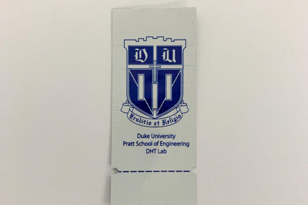 A small foil packet that features the seal of Duke University.