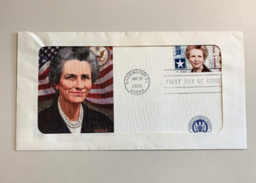 An envelope with a stamp on it featuring Frances Willis.