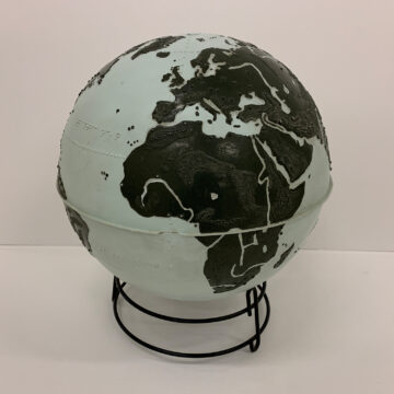 a gray and black globe with braille on a black stand